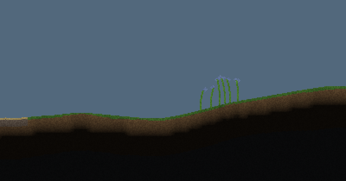 The Cinderlift surface at dusk: a grassy ridge over dark soil under a blue-grey sky.